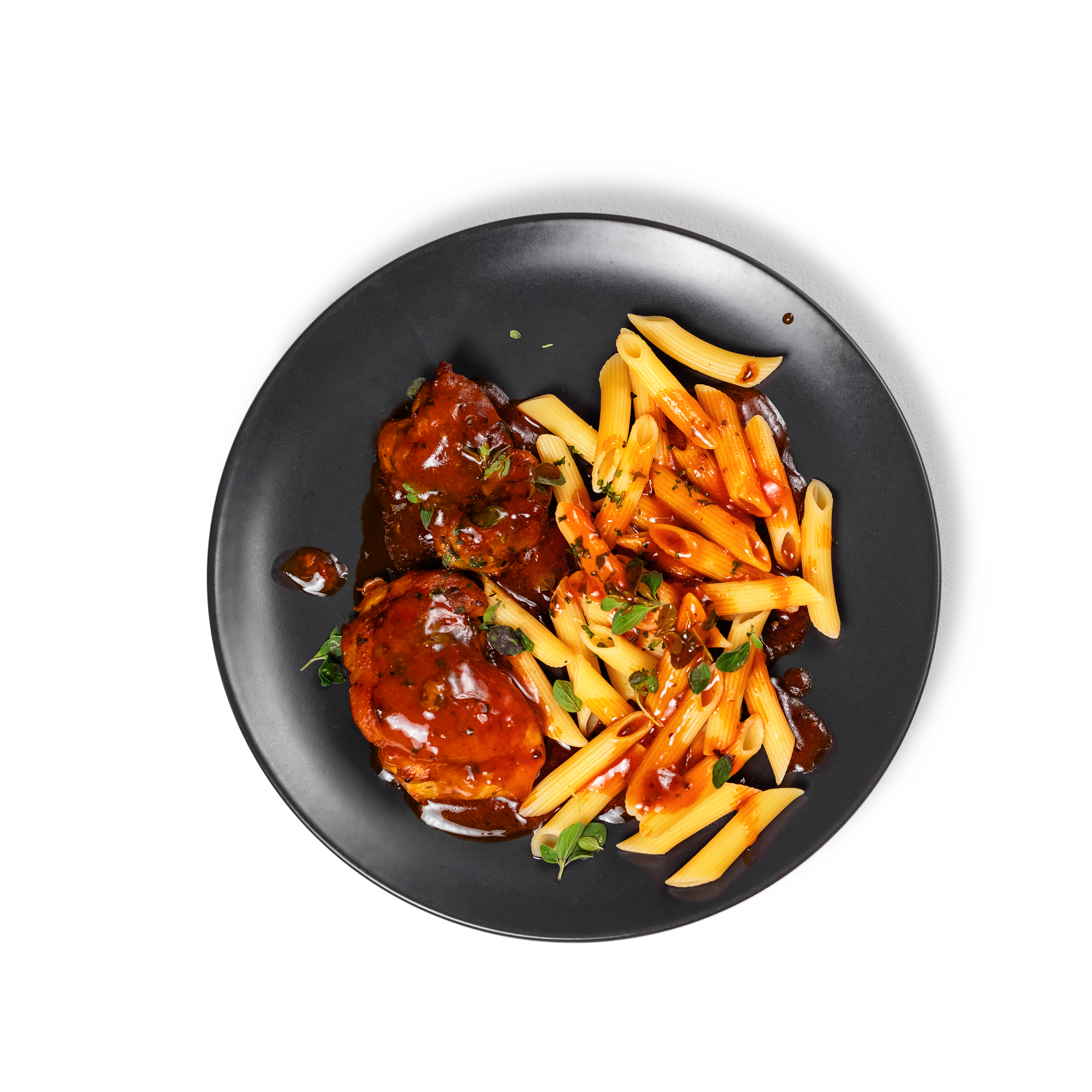 Plated chicken dinner in an olive-oil infused tomato sauce served with pasta.