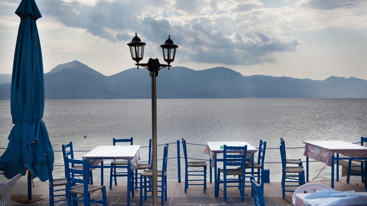 A beautiful sea side restaurant scene in Greece.