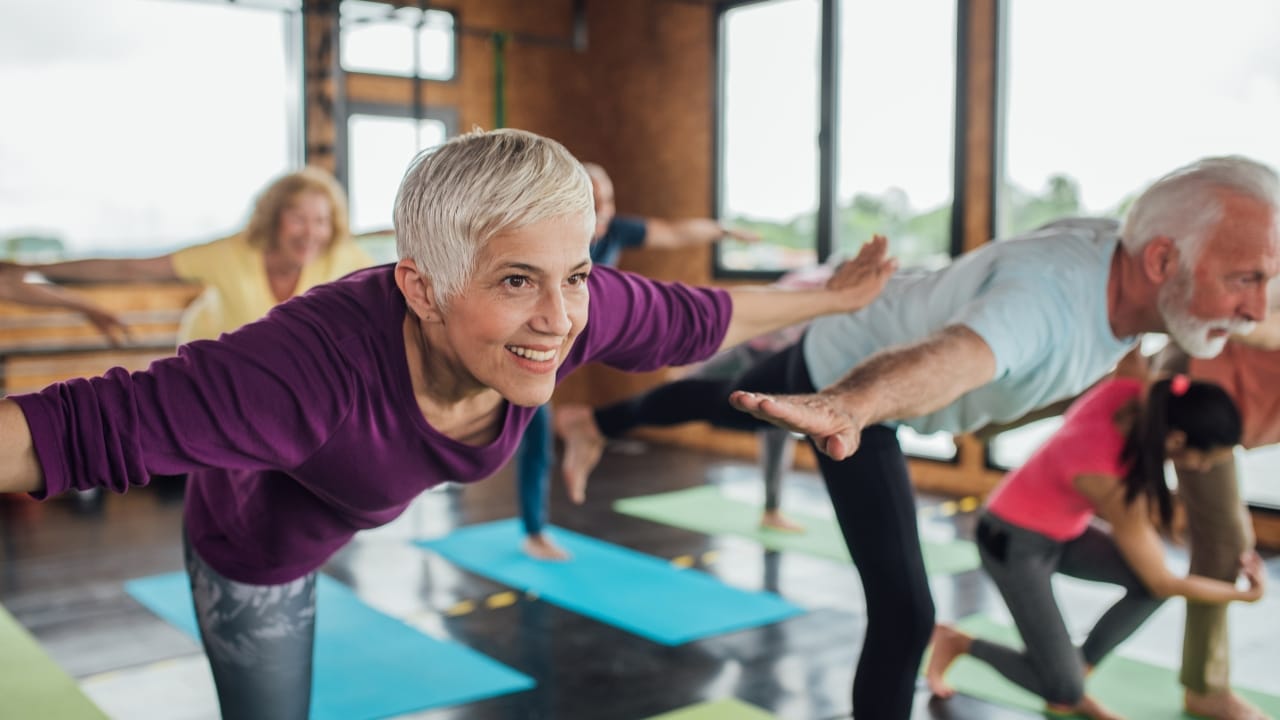 Vibrant seniors at an exercise class exude happiness, health, and contentment.