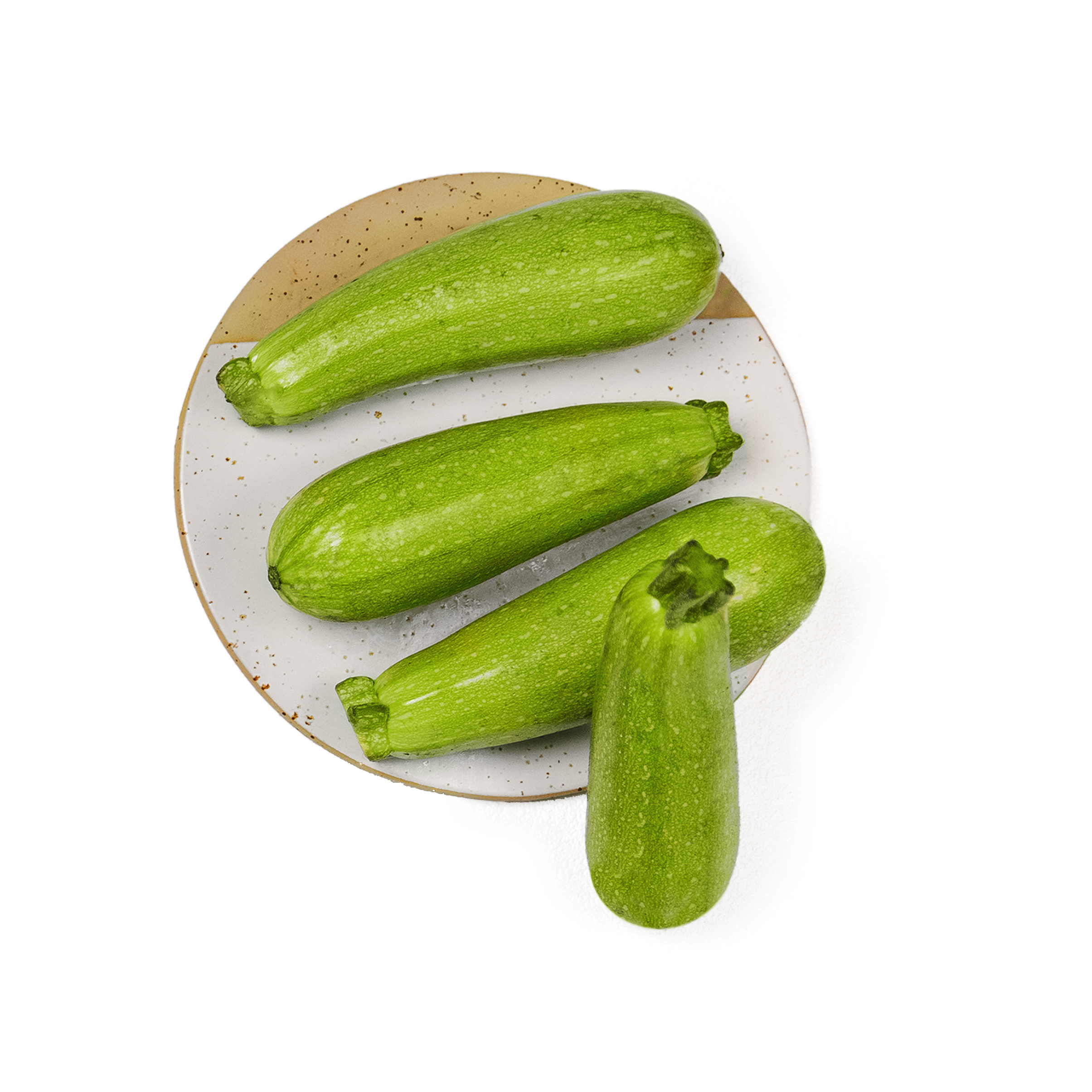 Freshly cleaned zucchini resting on a plate.