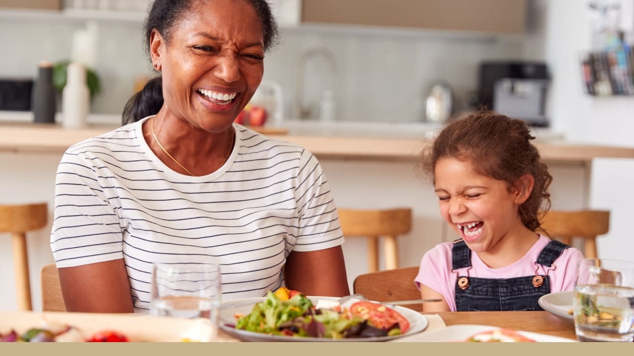 A young mother and daughter enjoying a nutritious meal together.